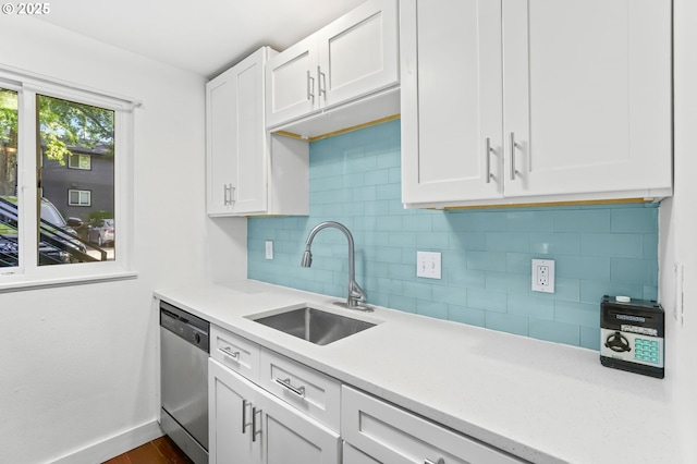 12622 NW Barnes Rd Unit 6, Portland, OR 97229 - kitchen featuring a sink, stainless steel dishwasher, backsplash, and light countertops