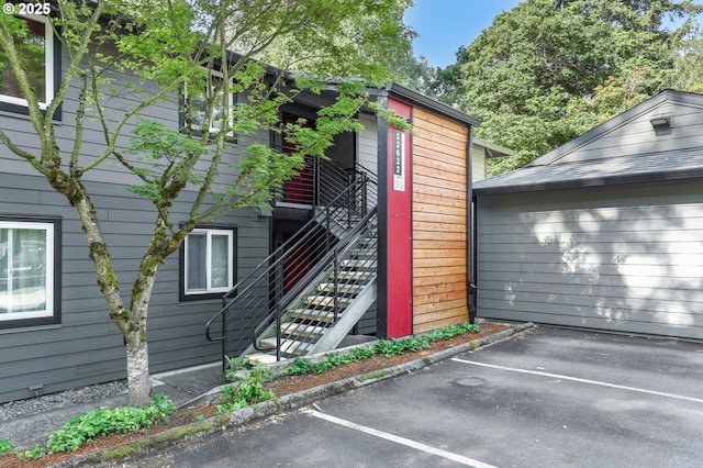 12622 NW Barnes Rd Unit 6, Portland, OR 97229 - view of property featuring uncovered parking and stairs