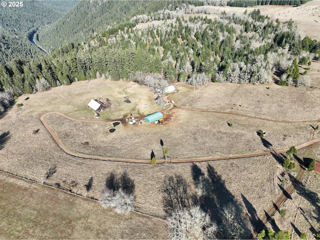 77220 Bar B L Ranch Rd, Westfir, OR 97492 - aerial view of property's location with a heavily wooded area and a mountainous background