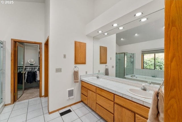 370 Wild Fern Dr, Winchester, OR 97495 - bathroom with a shower stall, double vanity, tile patterned floors, recessed lighting, and a towering ceiling