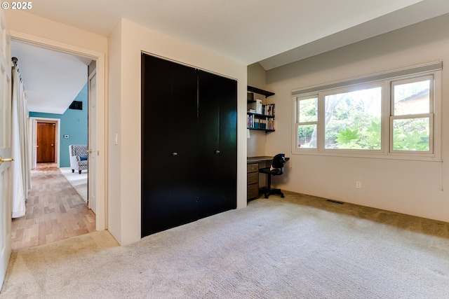 bedroom with carpet, a closet, and visible vents