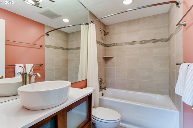 full bath featuring visible vents, shower / bath combo, vanity, toilet, and recessed lighting