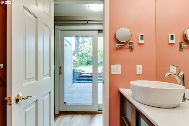 bathroom featuring vanity and wood finished floors
