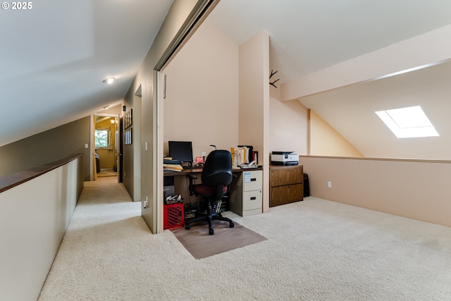 home office featuring carpet flooring and vaulted ceiling