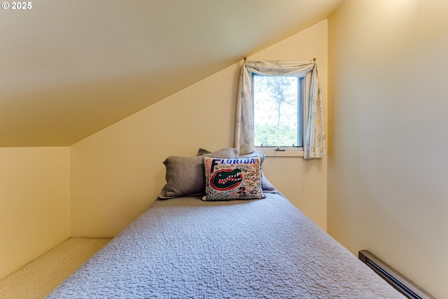 interior space featuring carpet flooring, lofted ceiling, and a baseboard heating unit