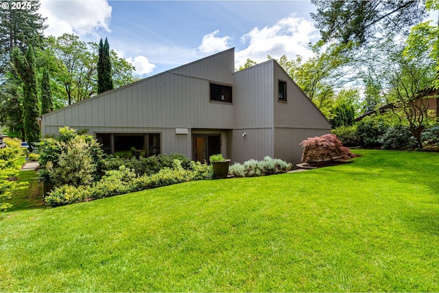 rear view of house with a yard