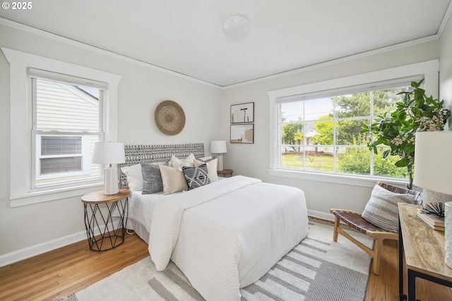 3737 NE 74th Ave, Portland, OR 97213 - bedroom featuring ornamental molding, baseboards, multiple windows, and wood finished floors