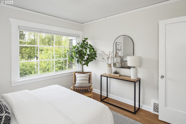 3737 NE 74th Ave, Portland, OR 97213 - bedroom featuring crown molding, wood finished floors, and baseboards