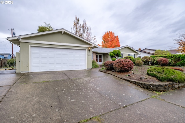 single story home with a garage