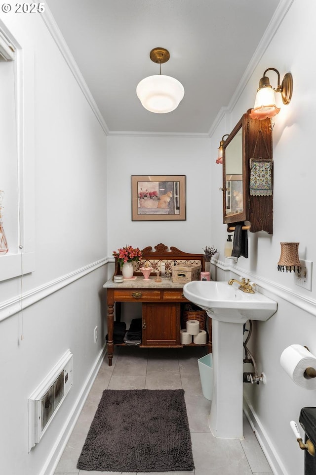 bathroom featuring tile patterned floors and crown molding