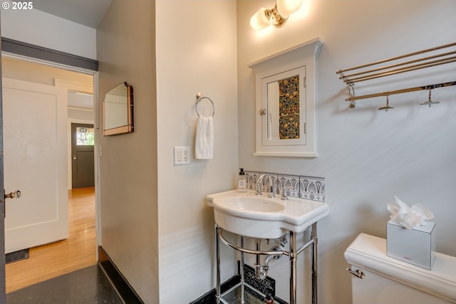 half bath featuring toilet