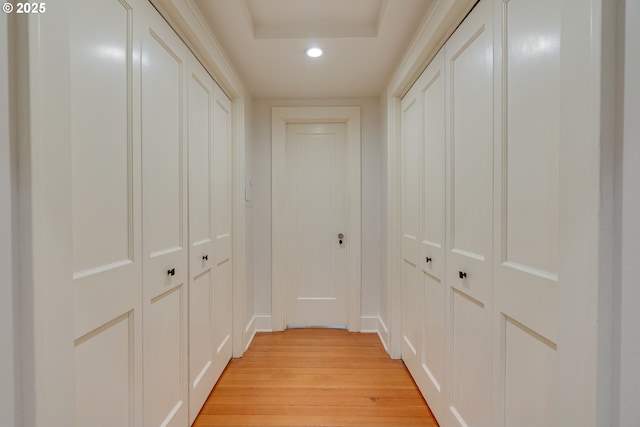 hall with recessed lighting, light wood-type flooring, and baseboards