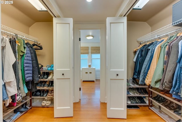 walk in closet featuring light wood-style floors