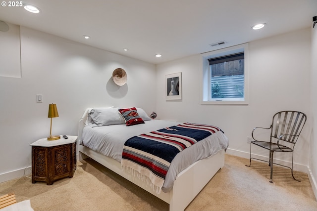 carpeted bedroom featuring recessed lighting and baseboards