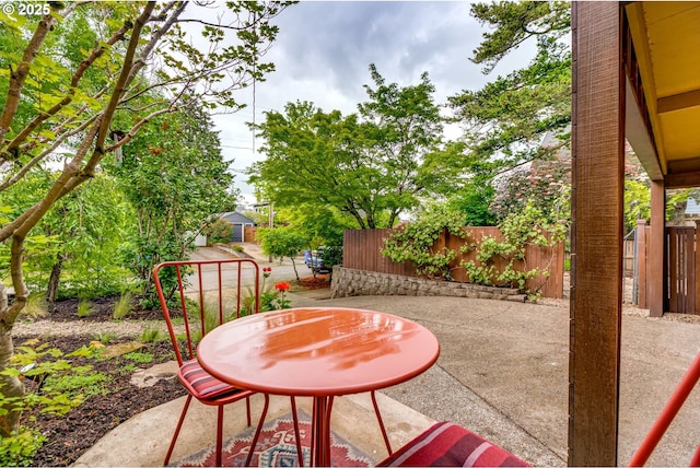 view of patio featuring fence