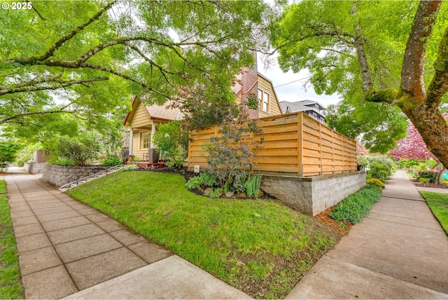view of front of property featuring a front lawn and a chimney