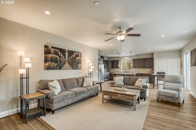 10380 SW Madrid Loop, Wilsonville, OR 97070 - living room with ceiling fan, light wood-style flooring, and recessed lighting
