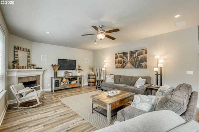 10380 SW Madrid Loop, Wilsonville, OR 97070 - living room featuring wood finished floors, a ceiling fan, recessed lighting, and a tiled fireplace