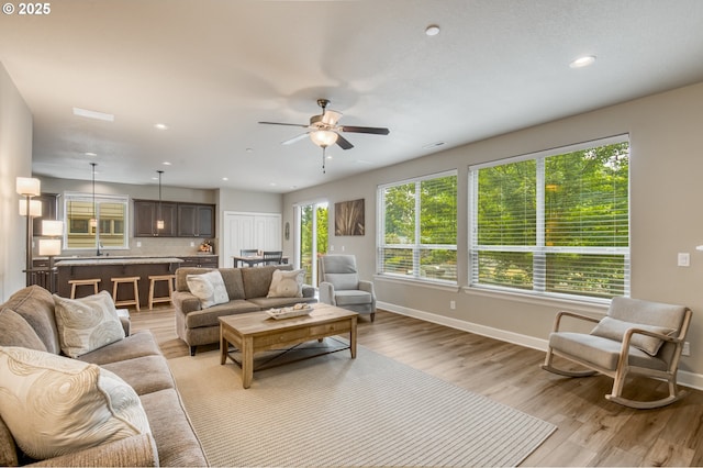 10380 SW Madrid Loop, Wilsonville, OR 97070 - living area with ceiling fan, recessed lighting, and light wood finished floors
