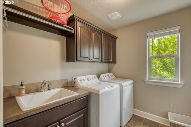 10380 SW Madrid Loop, Wilsonville, OR 97070 - laundry room with cabinet space, independent washer and dryer, and tile patterned flooring