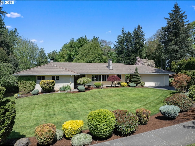 ranch-style house with a chimney, a front yard, and a garage