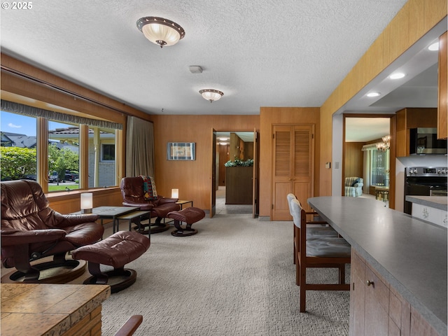 office area featuring a textured ceiling, a chandelier, and light carpet