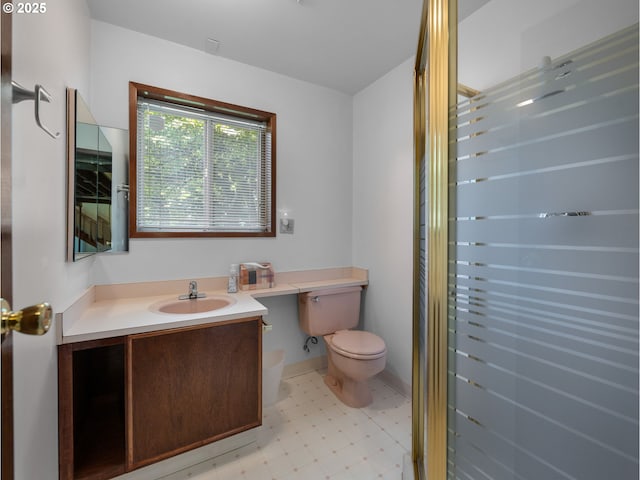 bathroom with vanity, tile patterned floors, and toilet