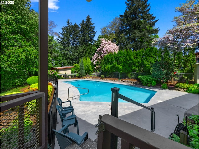 view of pool featuring a patio, fence, and a fenced in pool