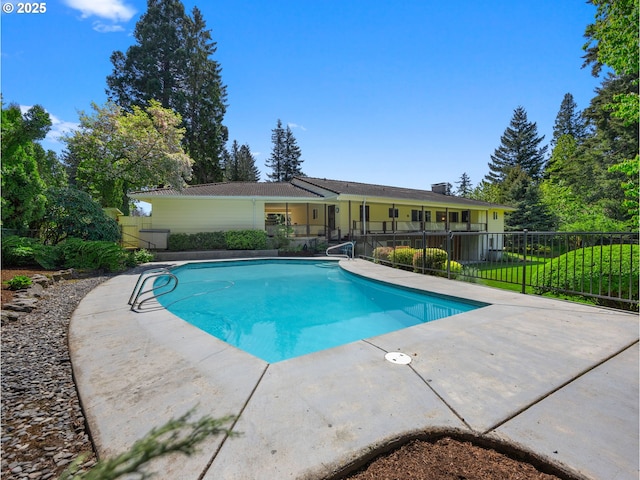 view of pool featuring a fenced in pool, fence, and a patio