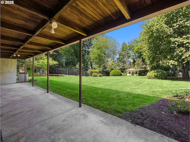 view of patio featuring fence