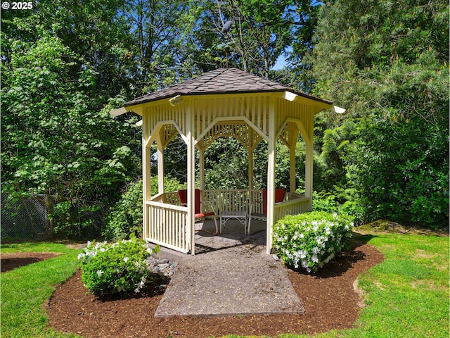view of yard featuring fence and a gazebo