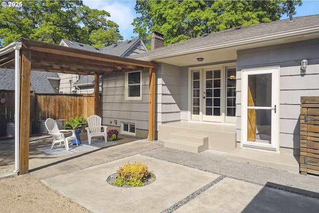 7625 N Fowler Ave, Portland, OR 97217 - rear view of property with a patio, a chimney, and roof with shingles