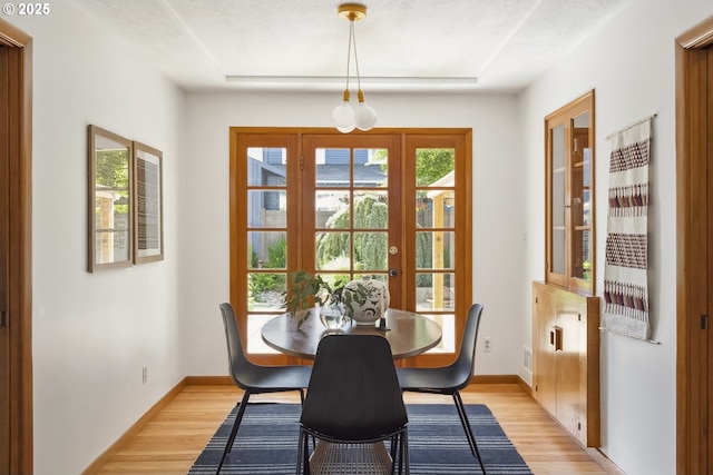 7625 N Fowler Ave, Portland, OR 97217 - dining room featuring light wood-style floors and baseboards