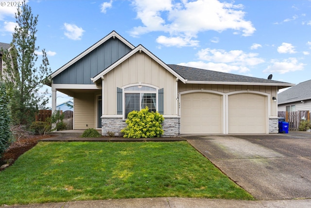 view of front of house featuring a garage, concrete driveway, board and batten siding, and fence