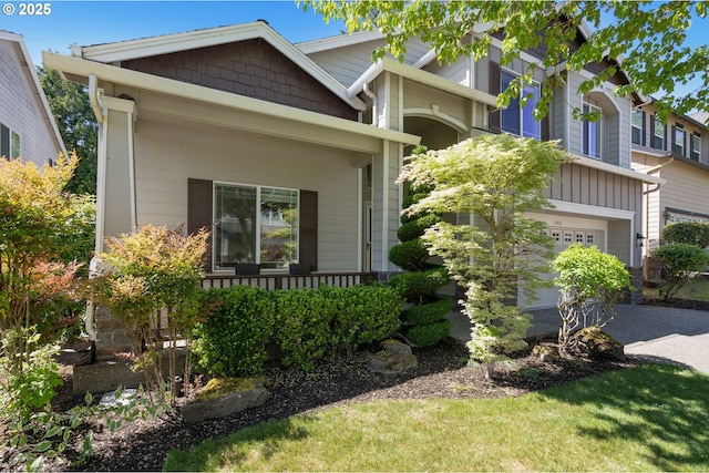 view of front of property with driveway and a garage