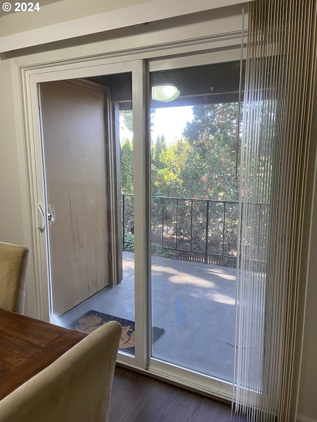 entryway with dark hardwood / wood-style flooring