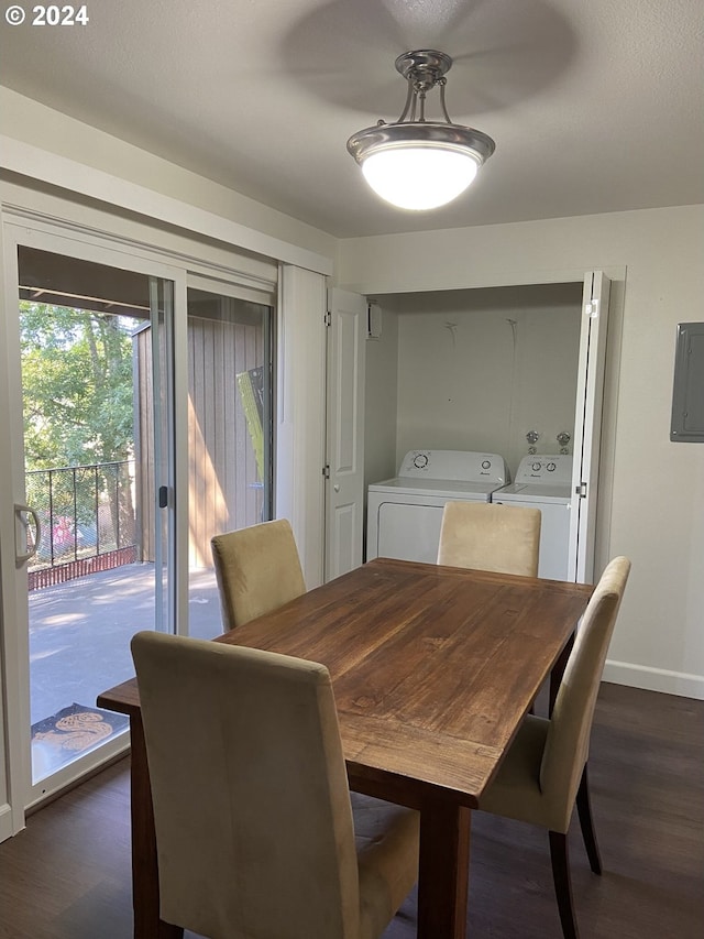 dining space with washing machine and clothes dryer, dark hardwood / wood-style flooring, and electric panel