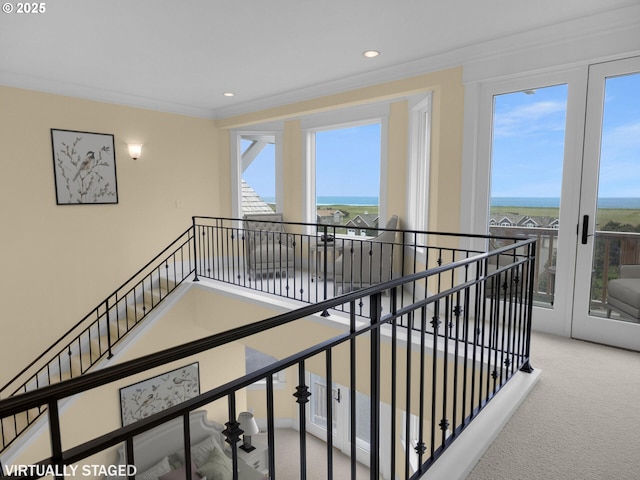 88902 Pinehurst Rd, Gearhart, OR 97138 - corridor featuring an upstairs landing, carpet flooring, ornamental molding, a water view, and recessed lighting