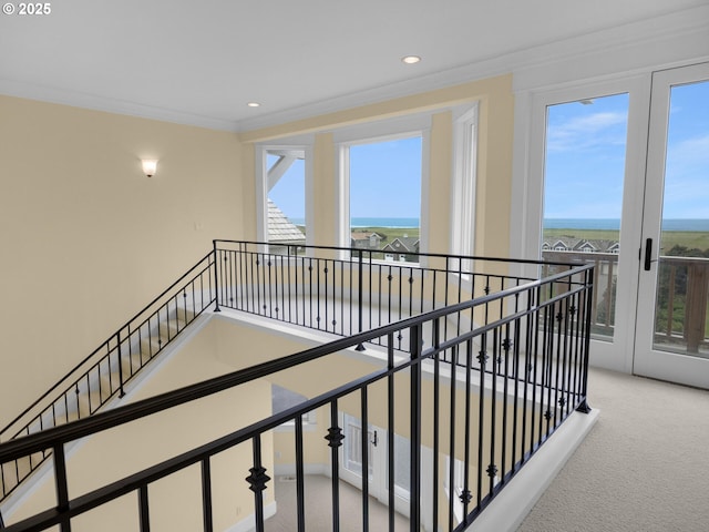 88902 Pinehurst Rd, Gearhart, OR 97138 - corridor featuring carpet, an upstairs landing, a water view, crown molding, and recessed lighting
