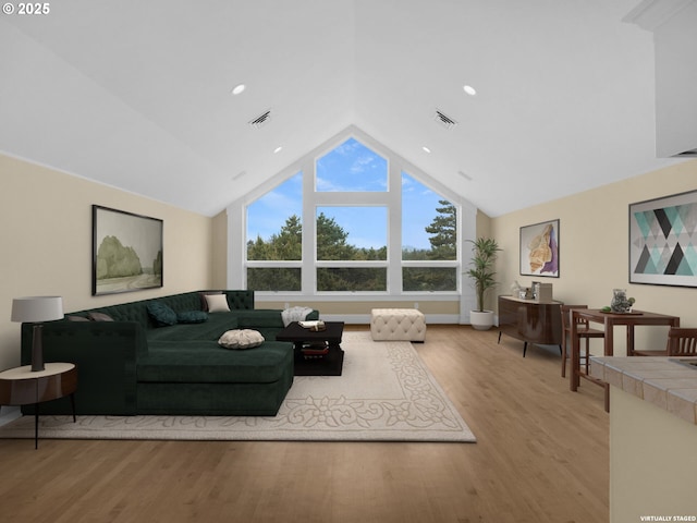 88902 Pinehurst Rd, Gearhart, OR 97138 - living area featuring light wood-type flooring, vaulted ceiling, and recessed lighting