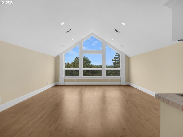 88902 Pinehurst Rd, Gearhart, OR 97138 - additional living space featuring light wood-style flooring, baseboards, lofted ceiling, and recessed lighting