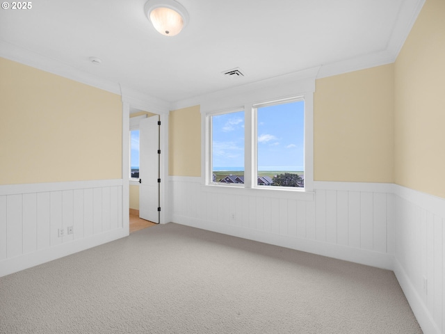 88902 Pinehurst Rd, Gearhart, OR 97138 - unfurnished room with a wainscoted wall and light colored carpet