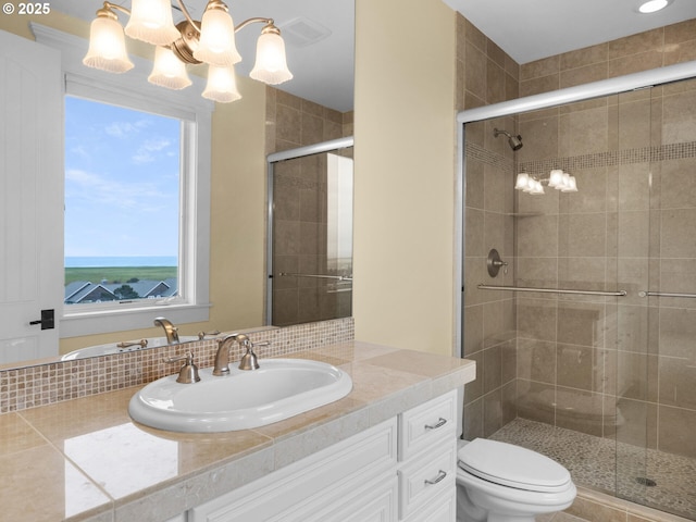 88902 Pinehurst Rd, Gearhart, OR 97138 - full bath with vanity, a shower stall, a chandelier, and toilet