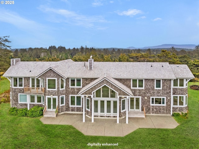 88902 Pinehurst Rd, Gearhart, OR 97138 - rear view of house with a chimney, a patio area, a lawn, and entry steps