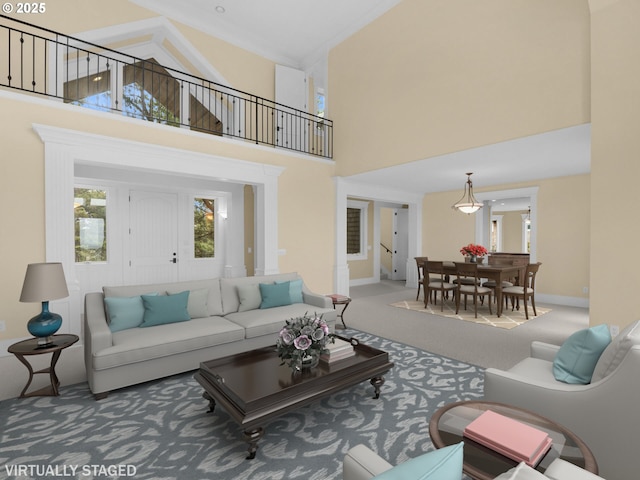 88902 Pinehurst Rd, Gearhart, OR 97138 - carpeted living area featuring a towering ceiling and baseboards