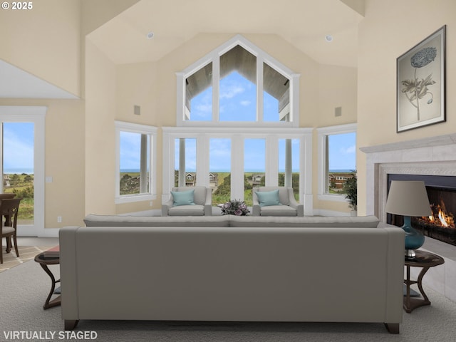 88902 Pinehurst Rd, Gearhart, OR 97138 - carpeted living area featuring high vaulted ceiling, a premium fireplace, and healthy amount of natural light