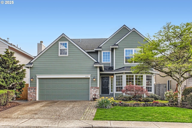 view of front of home featuring a front yard, fence, brick siding, driveway, and roof with shingles