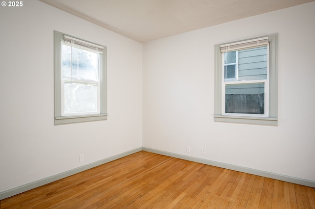 empty room featuring hardwood / wood-style flooring