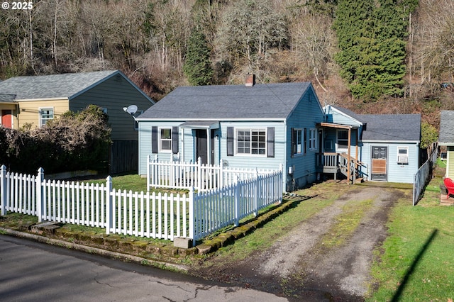 bungalow-style house featuring a front lawn