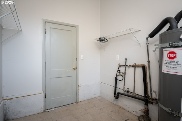 laundry room featuring water heater